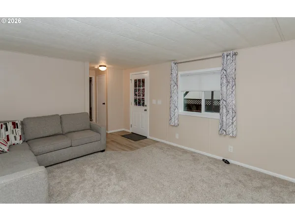 a living room with furniture and wall