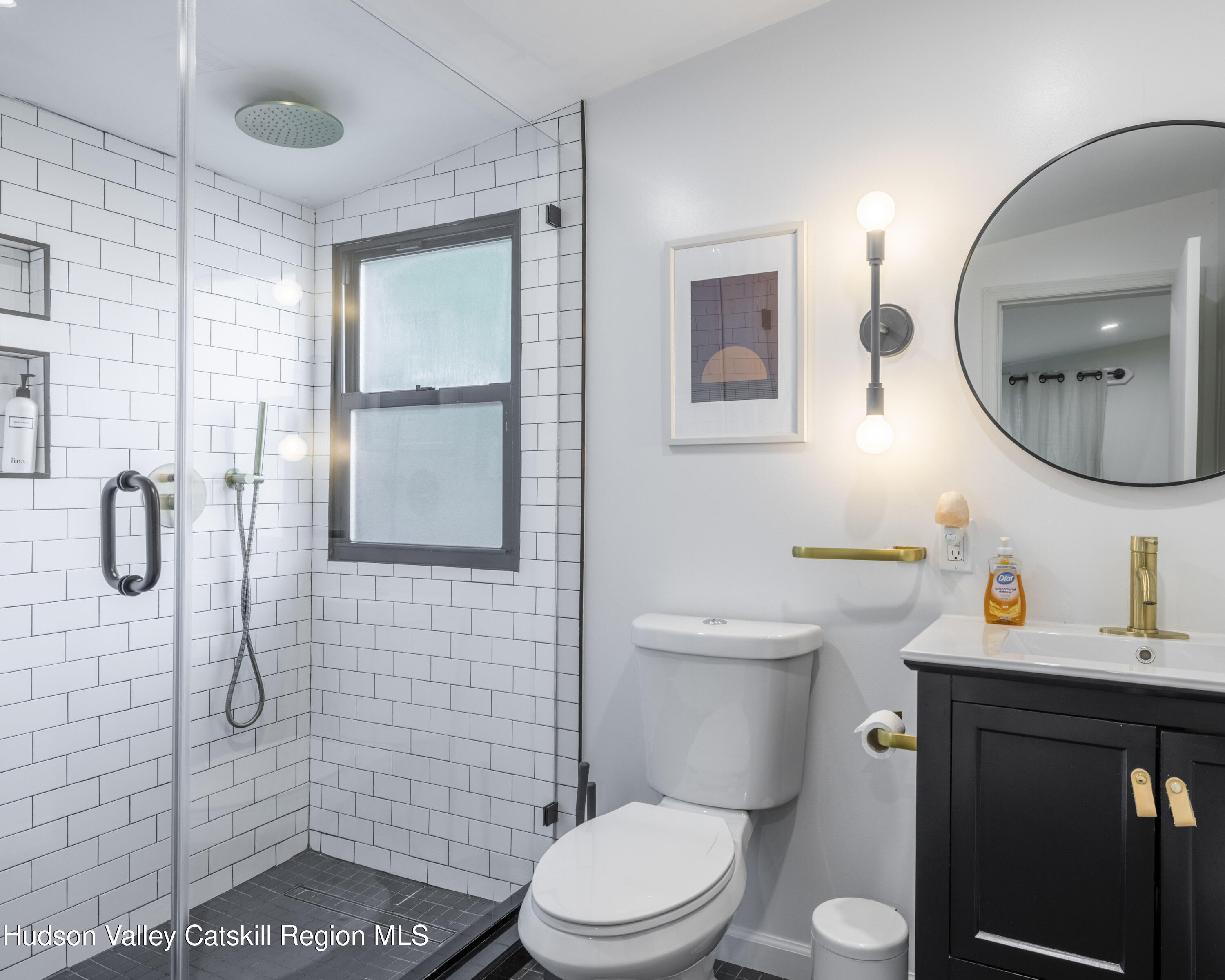 20 Sutton Hollow Road Windham, NY 12496 - Photo 16 of 30 a bathroom with a toilet sink vanity shower and mirror