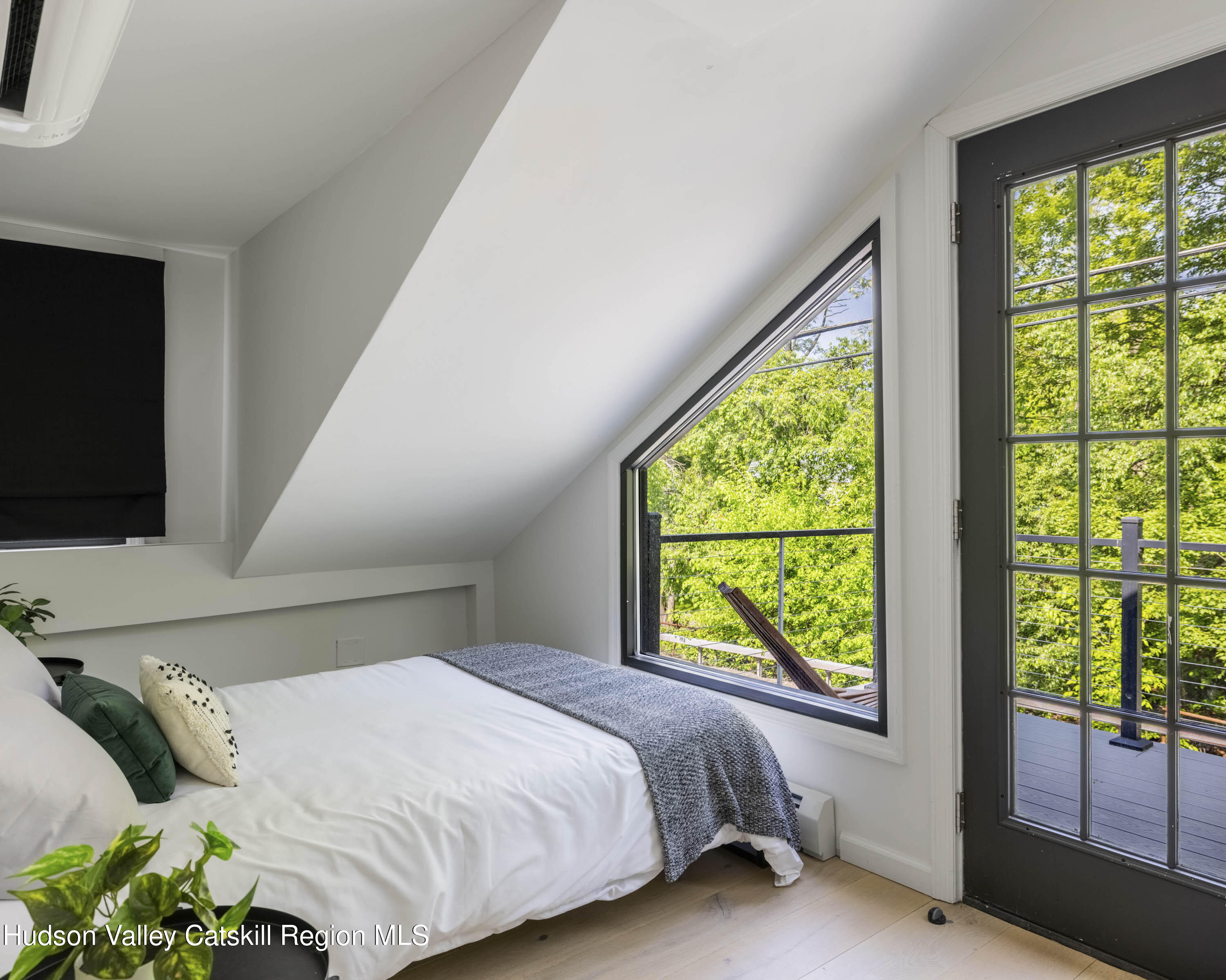 20 Sutton Hollow Road Windham, NY 12496 - Photo 18 of 30 a bedroom with a bed and window