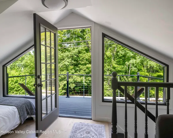 a view of a balcony with chairs
