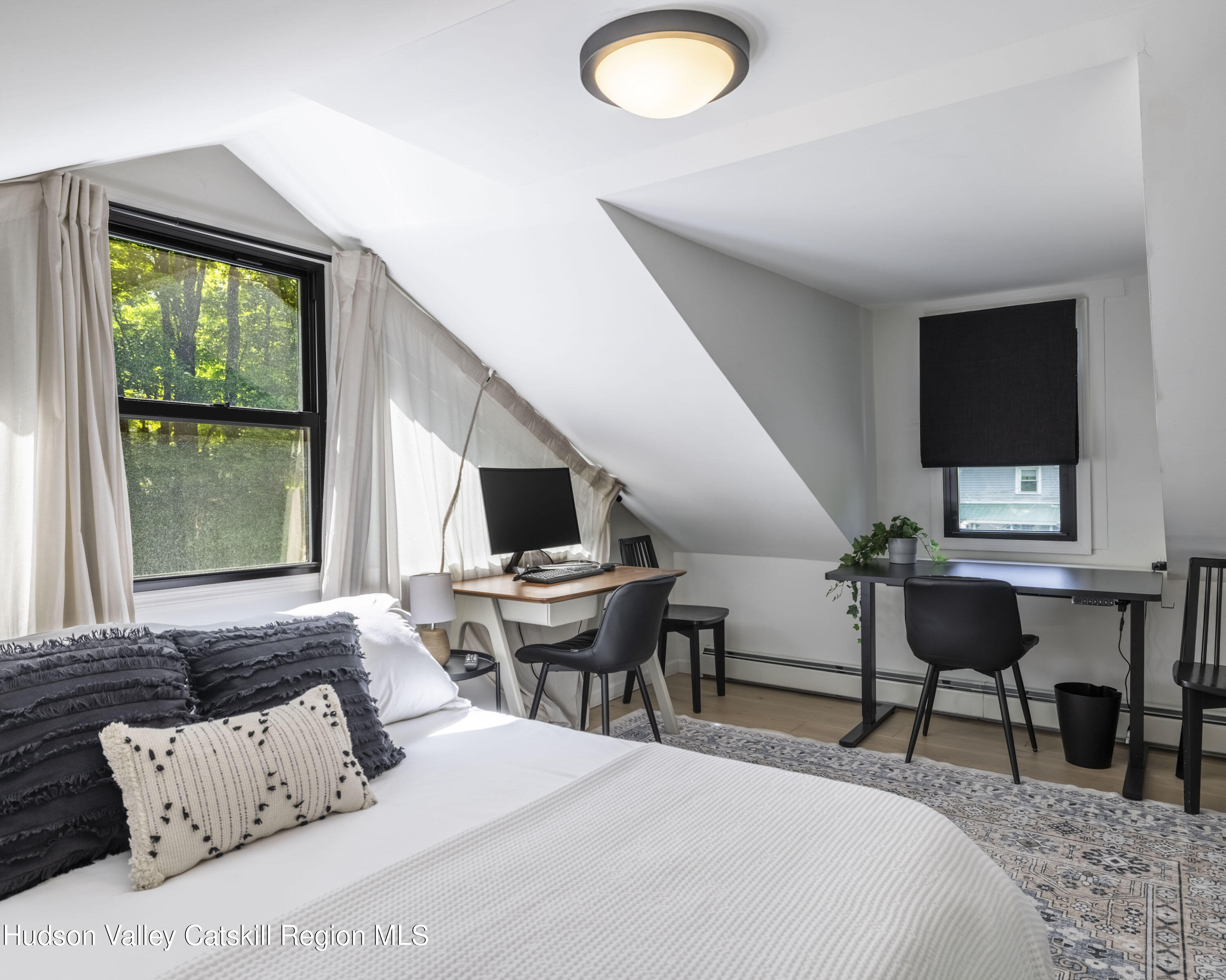 20 Sutton Hollow Road Windham, NY 12496 - Photo 25 of 30 a bedroom with a bed and a couch