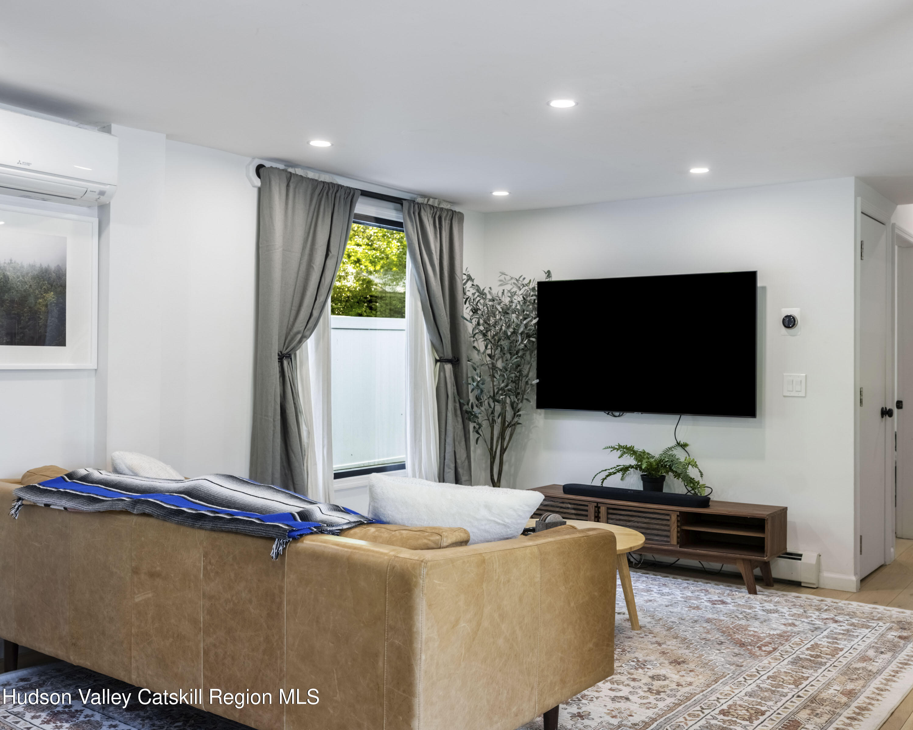 20 Sutton Hollow Road Windham, NY 12496 - Photo 3 of 30 a living room with furniture and a flat screen tv