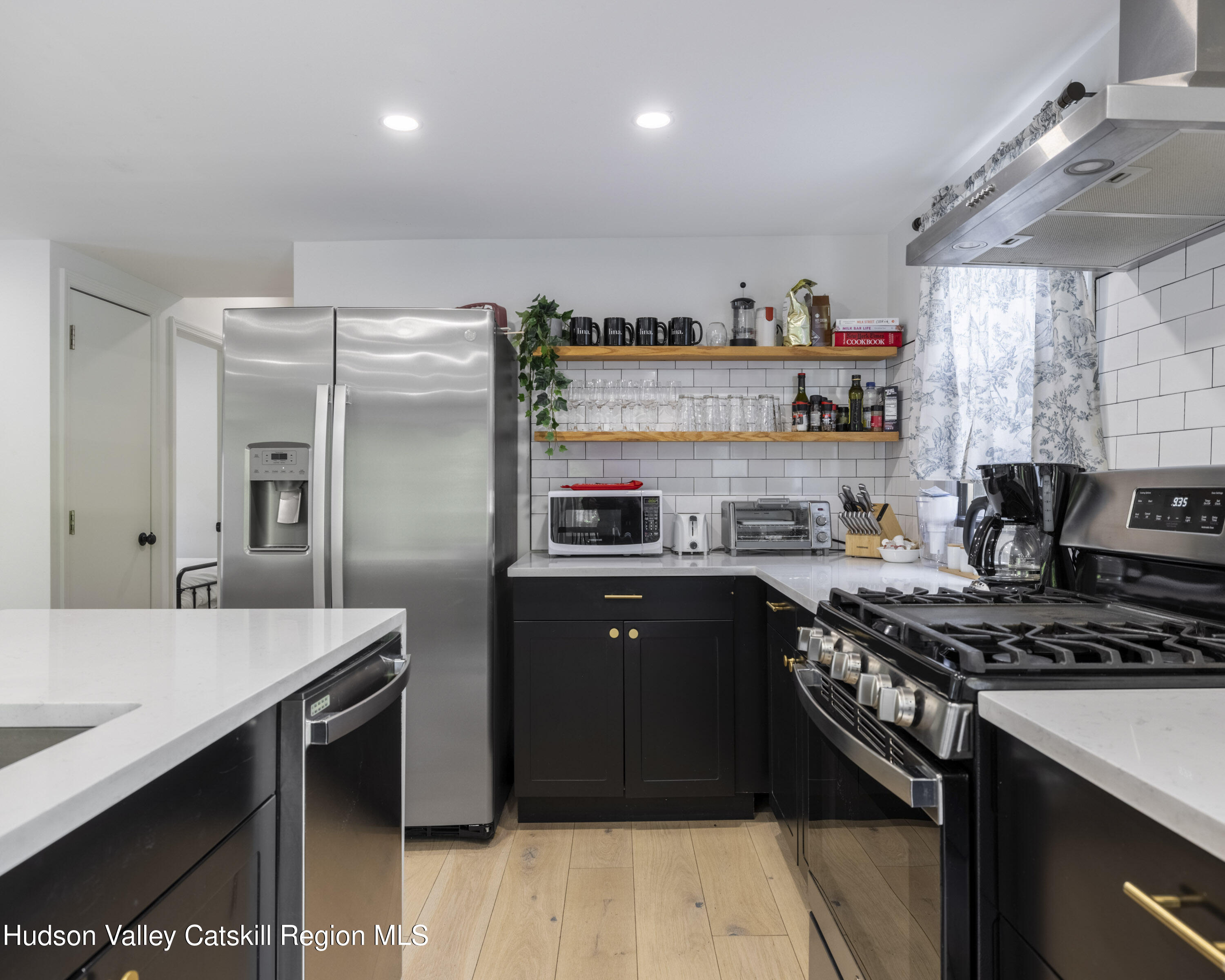 20 Sutton Hollow Road Windham, NY 12496 - Photo 7 of 30 a kitchen with stainless steel appliances granite countertop a stove a sink and a refrigerator