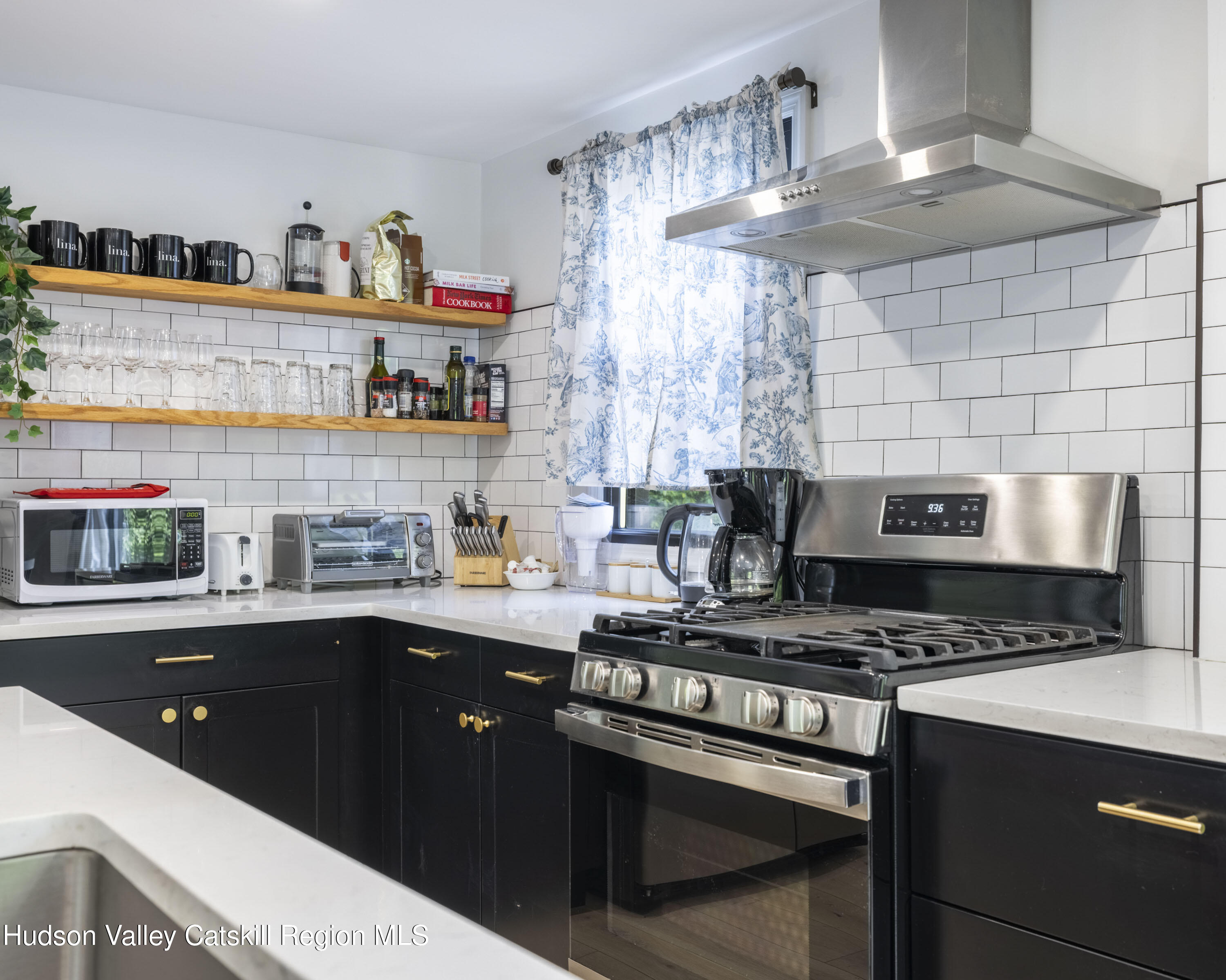 20 Sutton Hollow Road Windham, NY 12496 - Photo 8 of 30 a kitchen with stainless steel appliances a sink stove and cabinets