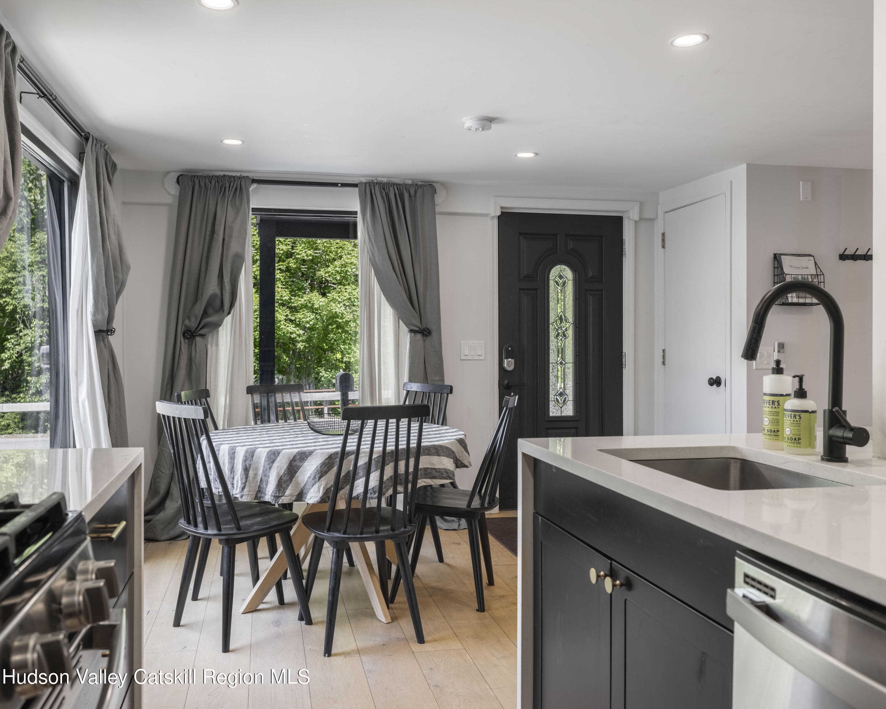 20 Sutton Hollow Road Windham, NY 12496 - Photo 9 of 30 a kitchen with a table chairs sink and cabinets