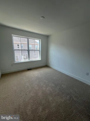 an empty room with a windows