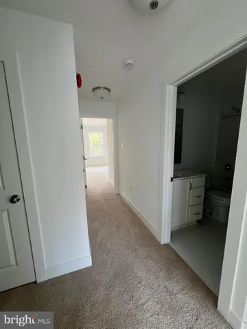 a view of hallway with washer and dryer