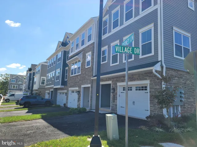 a view of a building with a yard