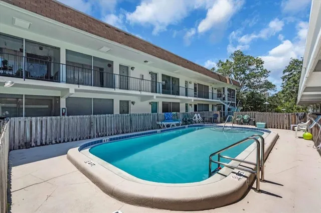 a view of swimming pool with seating space