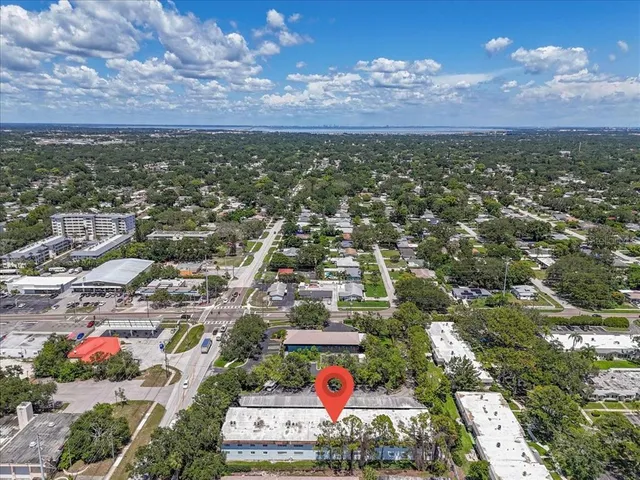 an aerial view of residential houses with outdoor space