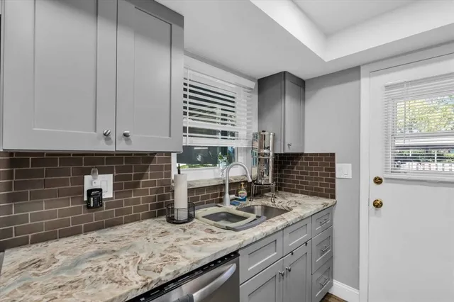 a kitchen with a stove and a sink