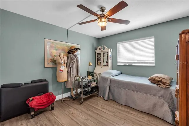 a bedroom with furniture and a window