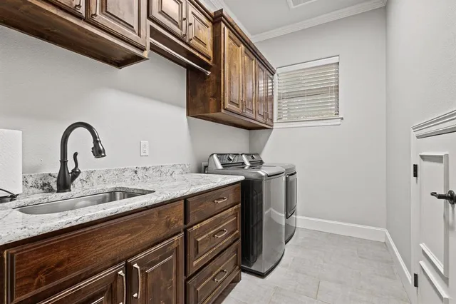 a kitchen with a sink and cabinets
