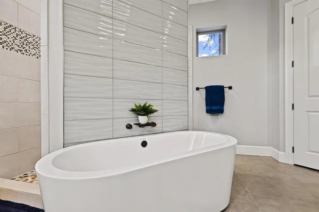 a white bath tub sitting in a bathroom