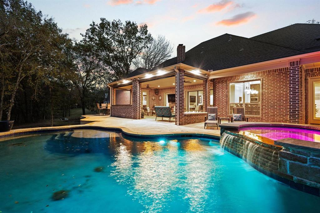 57 Arboretum Denison, TX 75020 - Photo 2 of 40 a view of a swimming pool with lounge chair