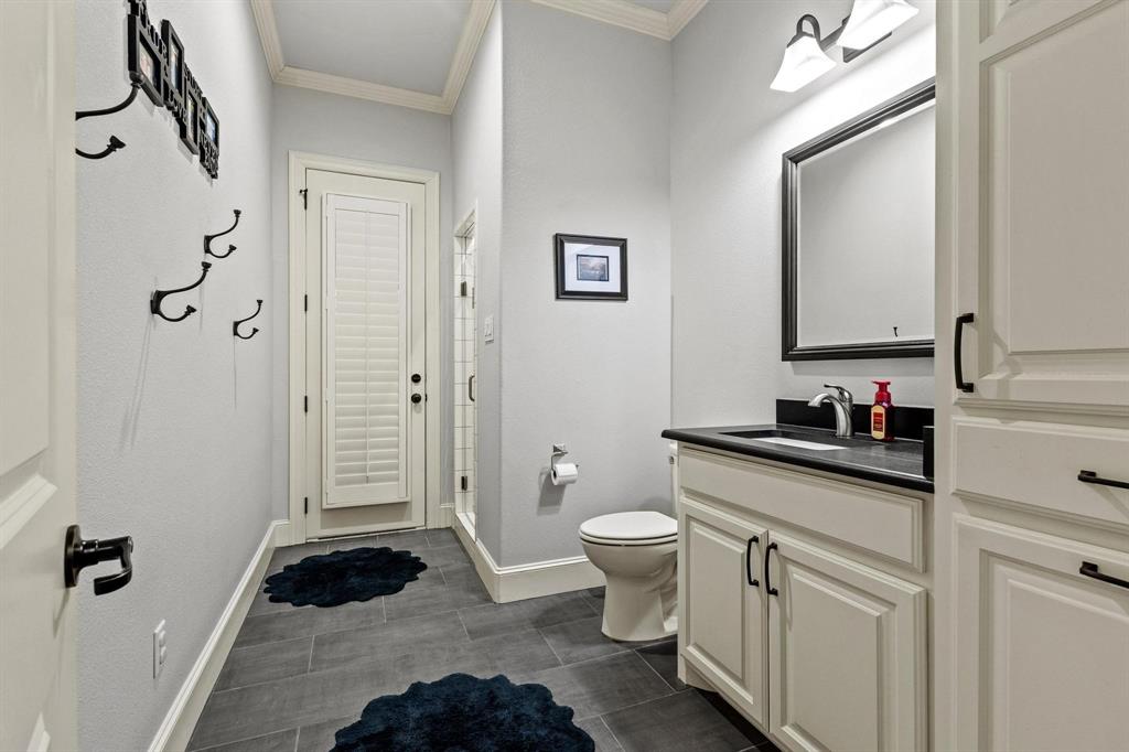 57 Arboretum Denison, TX 75020 - Photo 23 of 40 a bathroom with a sink toilet and shower