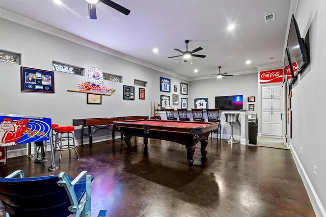 a living room with lots of furniture and kitchen view