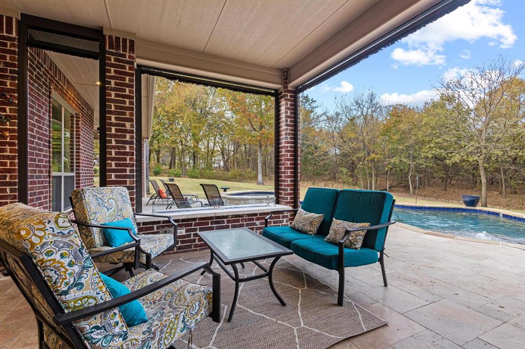 57 Arboretum Denison, TX 75020 - Photo 30 of 40 a living room with furniture and a large window