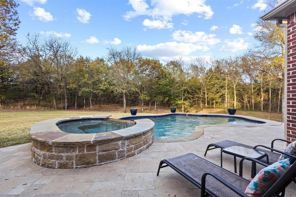 57 Arboretum Denison, TX 75020 - Photo 32 of 40 a view of a swimming pool with a patio