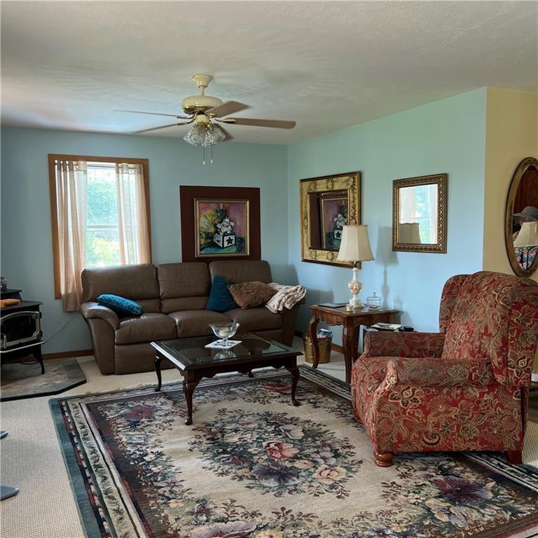 32753 Teepleville Road Centerville, PA 16404 - Photo 3 of 24 a living room with furniture a rug and a window