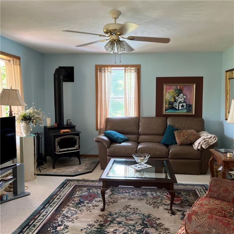 32753 Teepleville Road Centerville, PA 16404 - Photo 4 of 24 a living room with furniture a flat screen tv and a window
