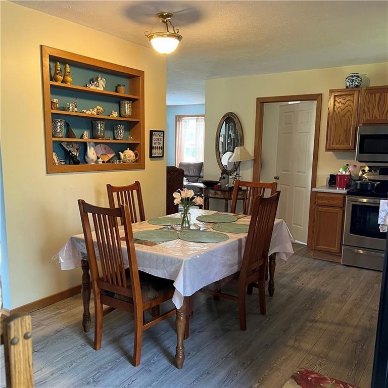 32753 Teepleville Road Centerville, PA 16404 - Photo 7 of 24 a view of a dining room with furniture and wooden floor