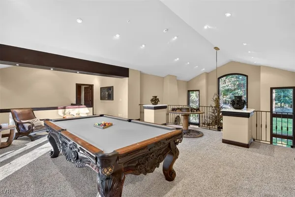 a bedroom with a bed a table and chair