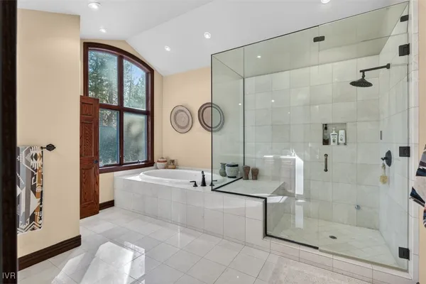 an empty room with windows cabinet and fire place