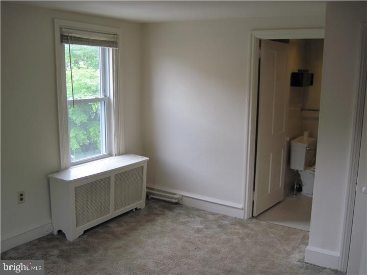 135 Sugartown Road, Unit 2B Wayne, PA 19087 - Photo 2 of 10 a room with window and closet