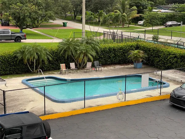a view of a swimming pool with a patio
