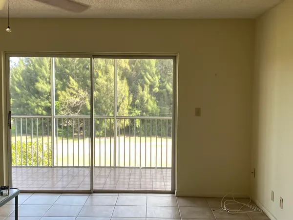 a view of a room that has a large window