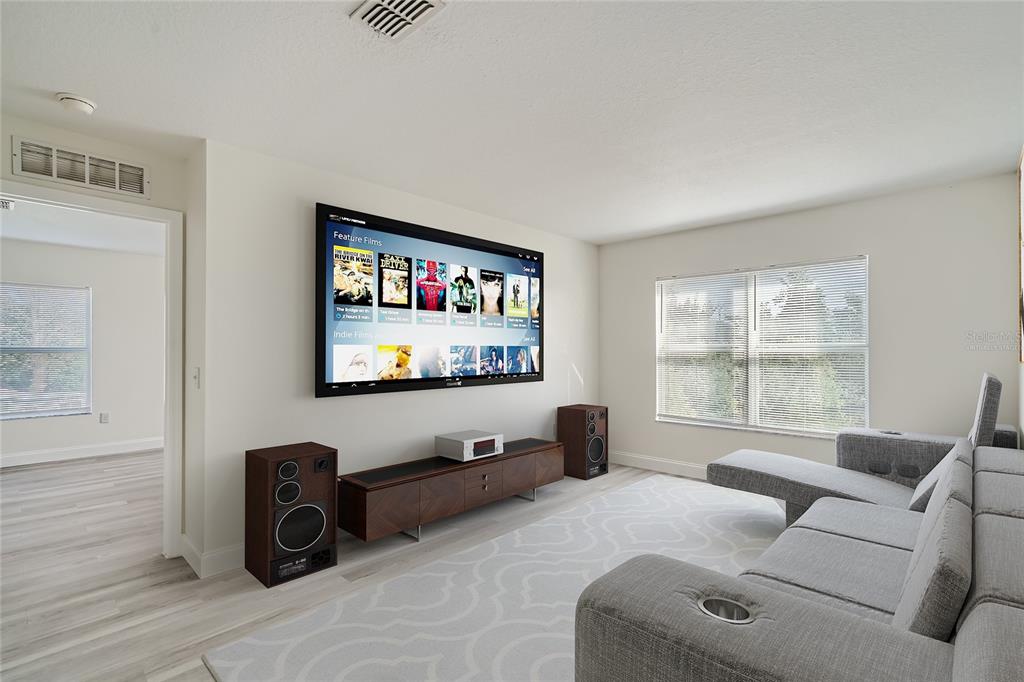 5424 Hammock View Lane Apollo Beach, FL 33572 - Photo 20 of 55 a living room with furniture tv and a window