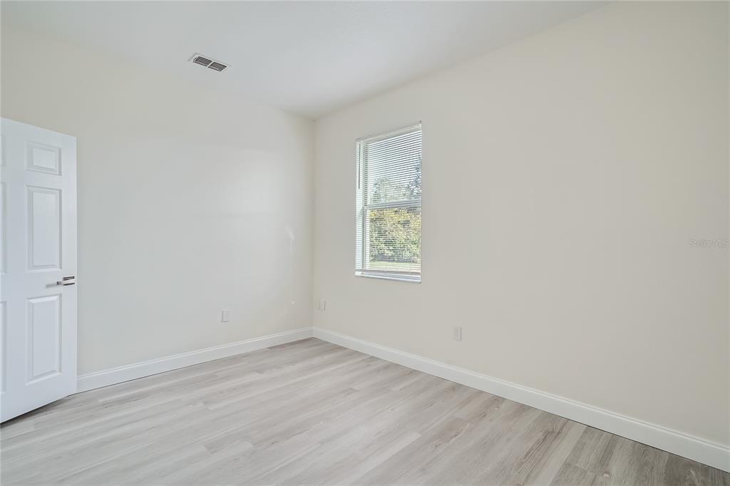5424 Hammock View Lane Apollo Beach, FL 33572 - Photo 23 of 55 wooden floor in an empty room