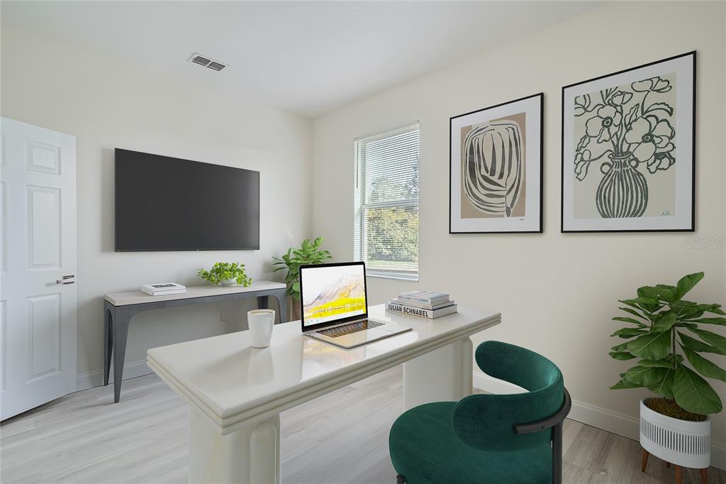 5424 Hammock View Lane Apollo Beach, FL 33572 - Photo 24 of 55 a kitchen with a table chair and potted plant