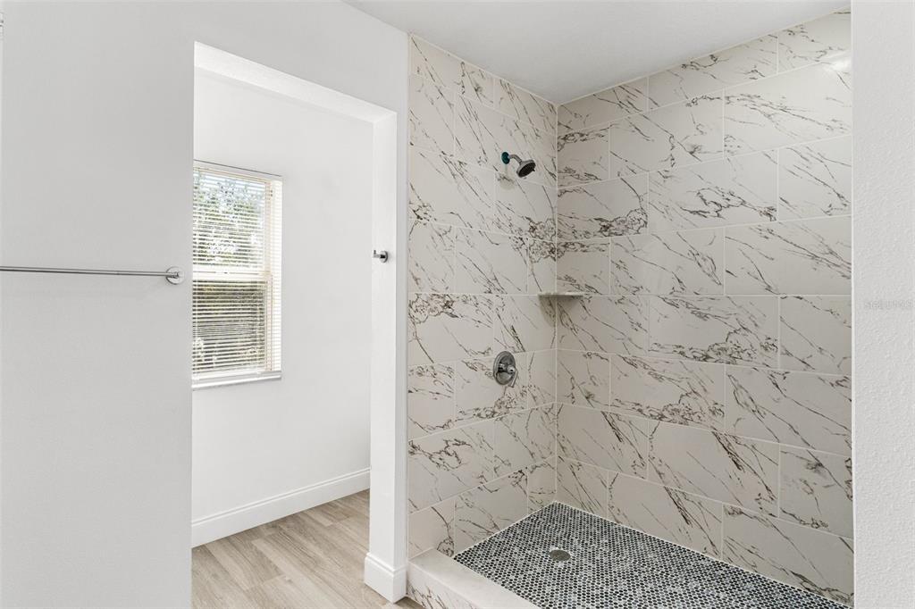 5424 Hammock View Lane Apollo Beach, FL 33572 - Photo 33 of 55 a bathroom with a shower