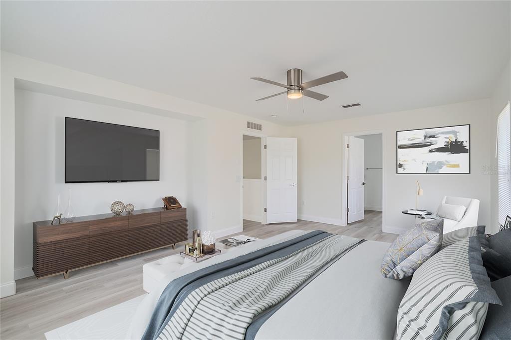 5424 Hammock View Lane Apollo Beach, FL 33572 - Photo 36 of 55 a bedroom with a bed and a flat screen tv