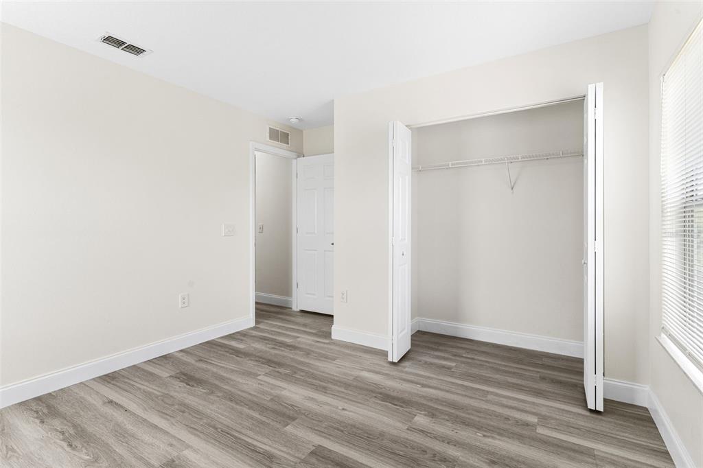5424 Hammock View Lane Apollo Beach, FL 33572 - Photo 38 of 55 a view of an empty room with wooden floor
