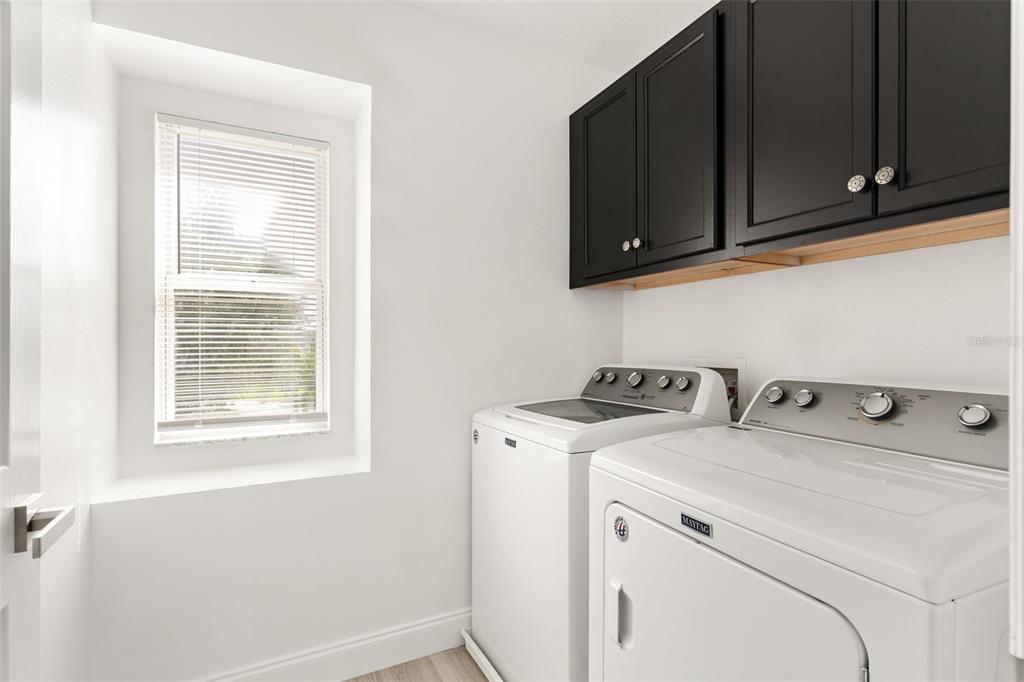 5424 Hammock View Lane Apollo Beach, FL 33572 - Photo 42 of 55 a utility room with dryer and washer