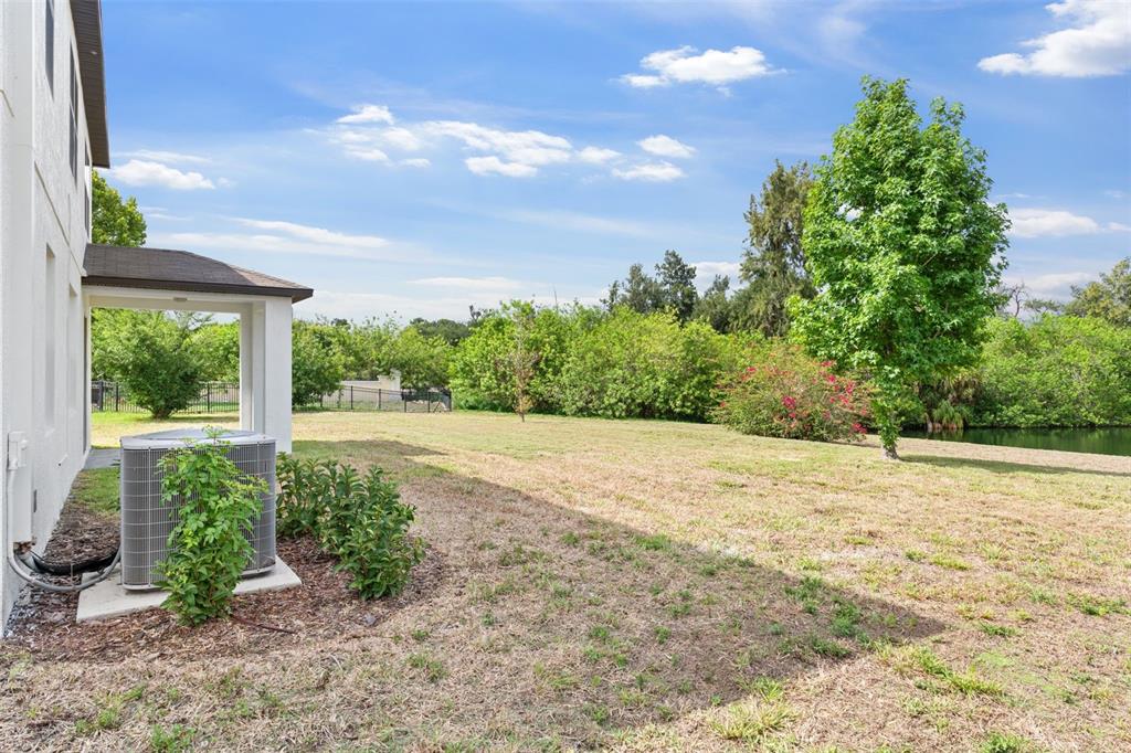 5424 Hammock View Lane Apollo Beach, FL 33572 - Photo 43 of 55 a view of a backyard of the house