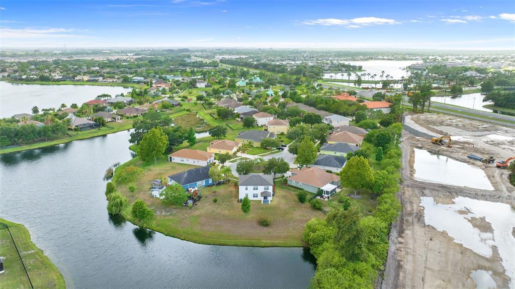 5424 Hammock View Lane Apollo Beach, FL 33572 - Photo 47 of 55 an aerial view of a house with a lake view