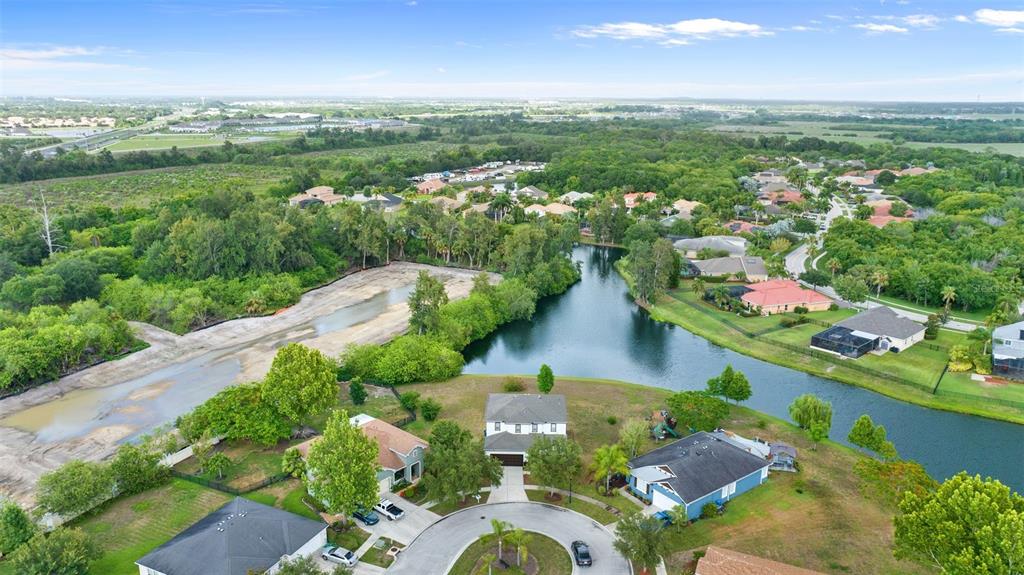 5424 Hammock View Lane Apollo Beach, FL 33572 - Photo 51 of 55 an aerial view of lake residential houses with outdoor space and seating