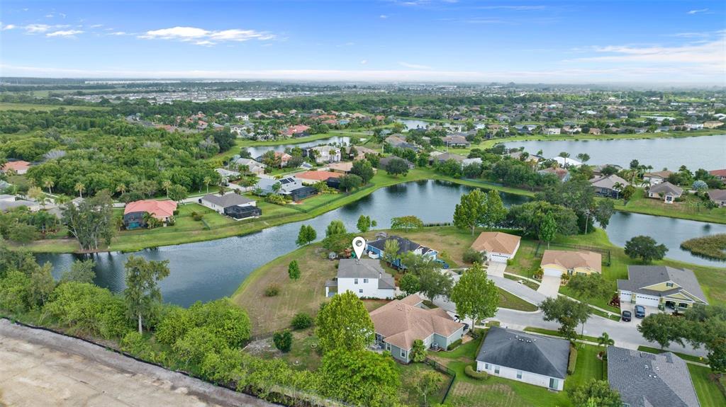 5424 Hammock View Lane Apollo Beach, FL 33572 - Photo 54 of 55 an aerial view of lake residential houses with outdoor space and swimming pool