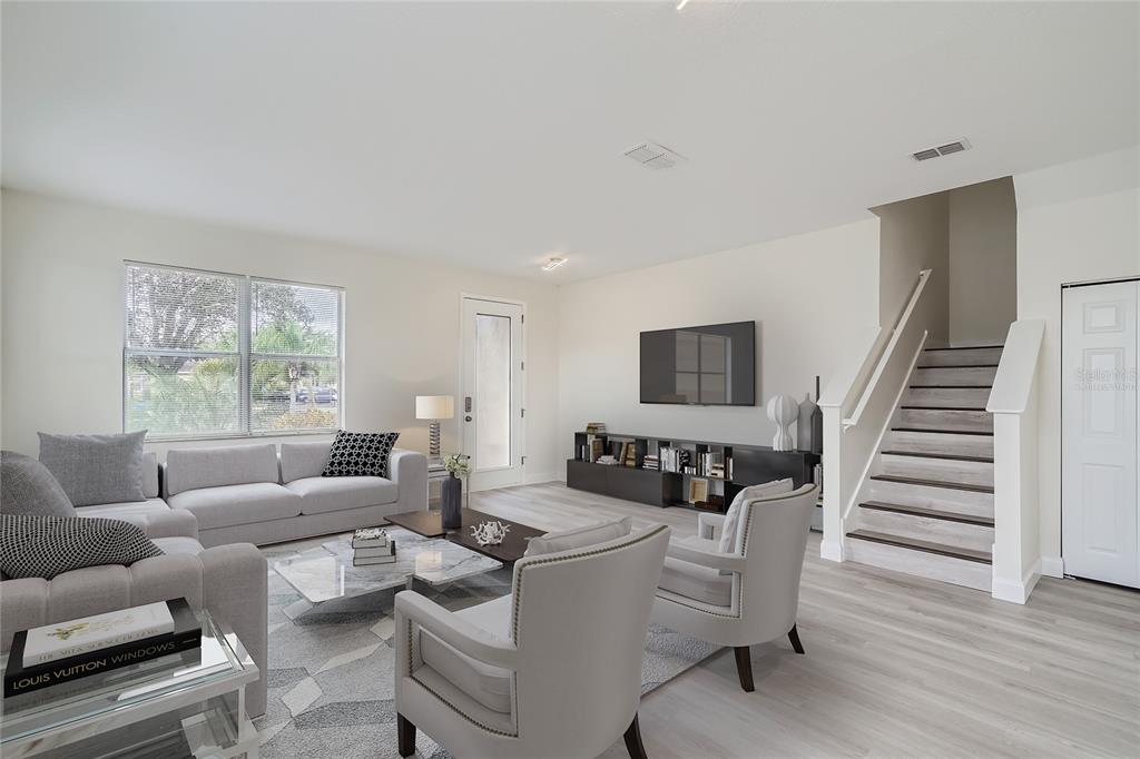 5424 Hammock View Lane Apollo Beach, FL 33572 - Photo 7 of 55 a living room with furniture and wooden floor