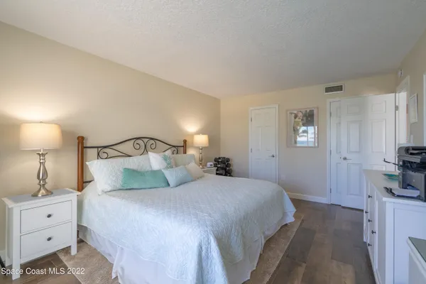 a bedroom with two beds and a window