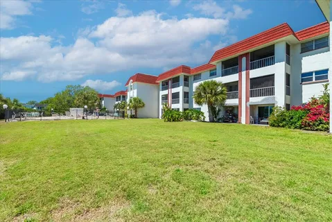 a view of a swimming pool with a yard