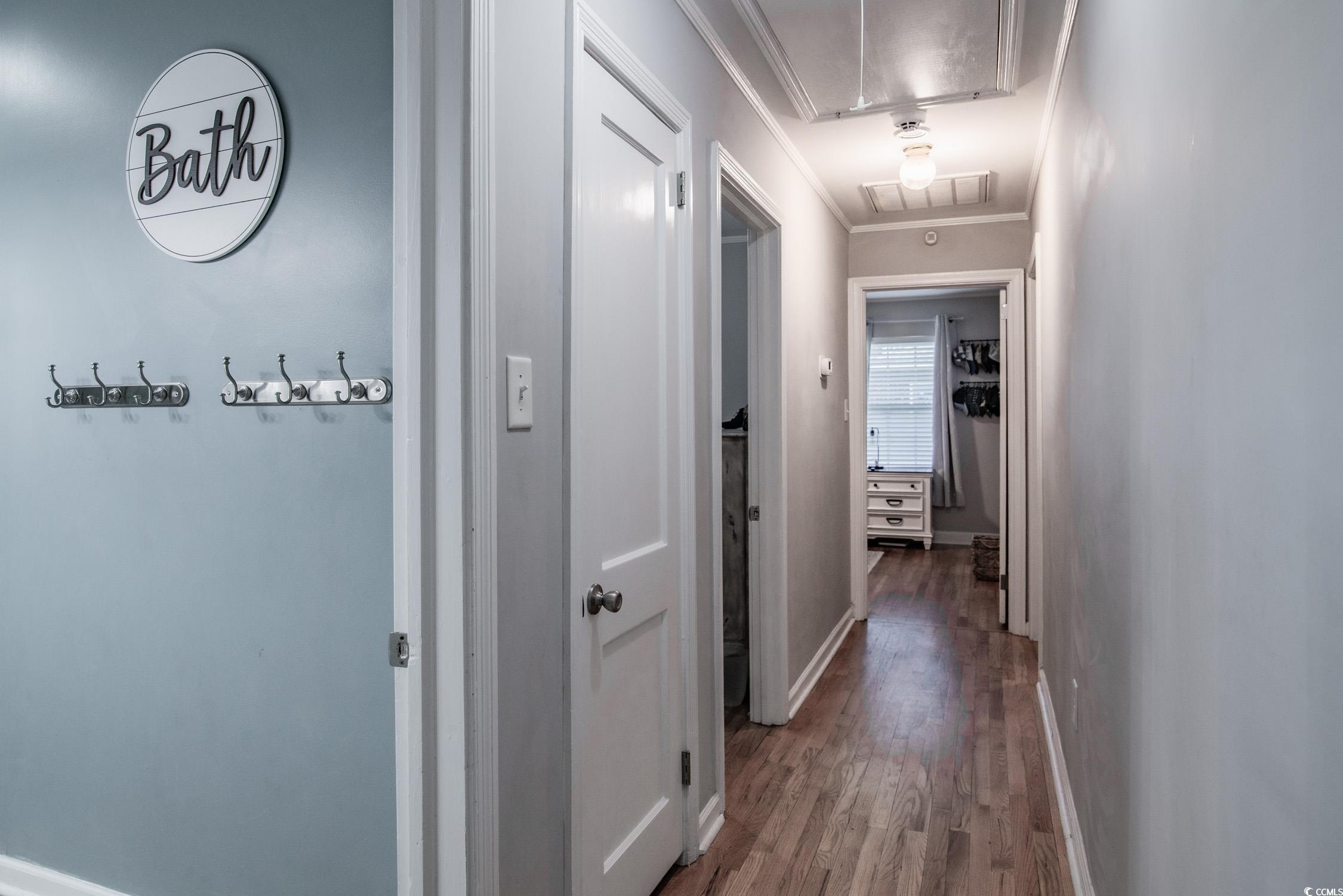 1916 Jasper Street Georgetown, SC 29440 - Photo 11 of 35 Corridor with ornamental molding and hardwood / wo