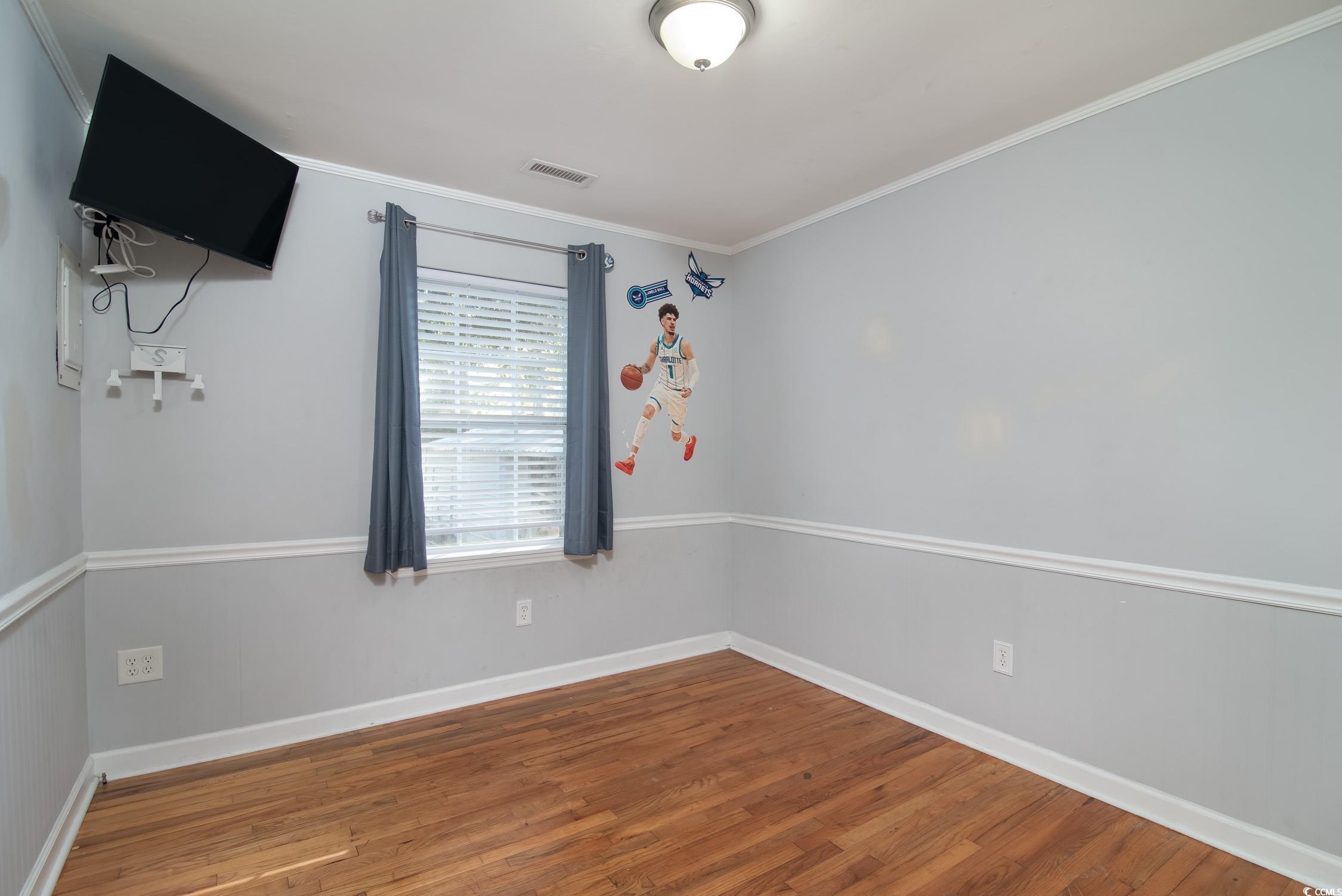1916 Jasper Street Georgetown, SC 29440 - Photo 14 of 35 Empty room featuring hardwood / wood-style floors