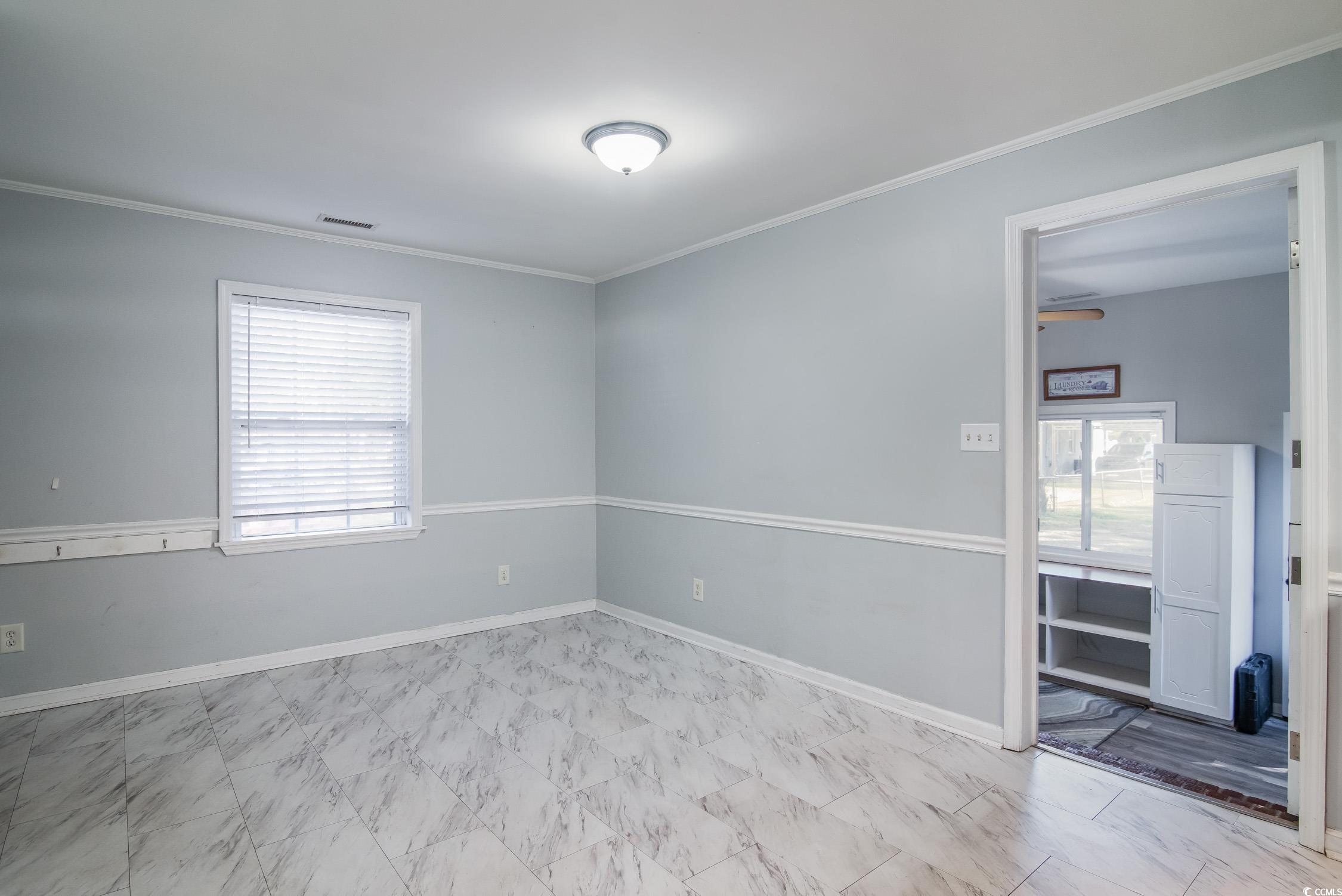 1916 Jasper Street Georgetown, SC 29440 - Photo 23 of 35 Empty room with crown molding