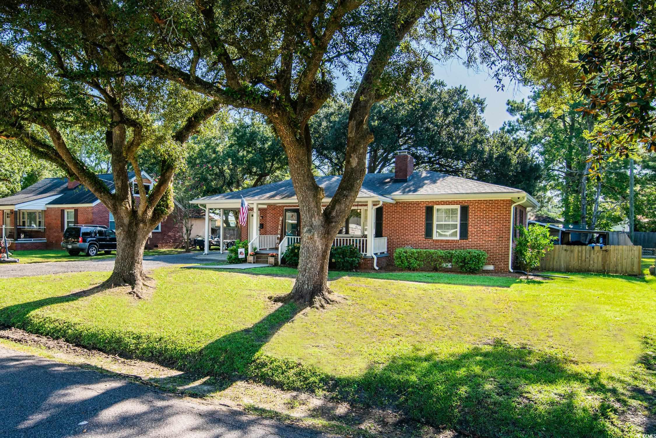 1916 Jasper Street Georgetown, SC 29440 - Photo 3 of 35 Single story home featuring a porch and a front ya