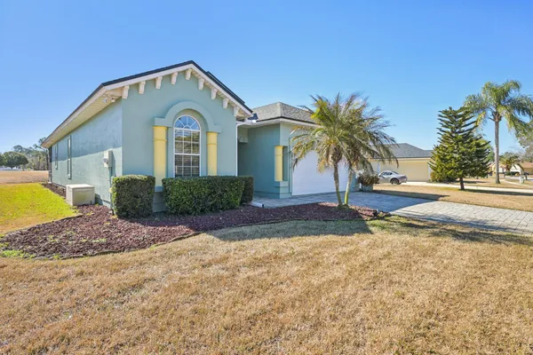 a dining room with furniture and a chandelier
